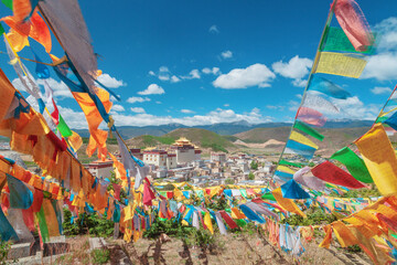 Colored flags on the background of a Buddhist monastery