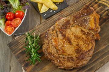 veal chop with potatoes and vegetables