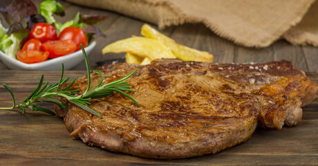 veal chop with potatoes and vegetables