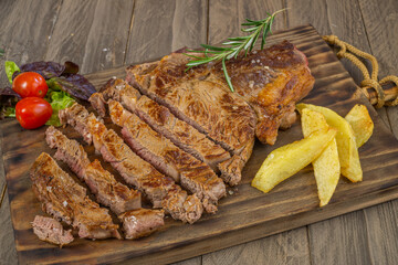 veal chop with potatoes and vegetables