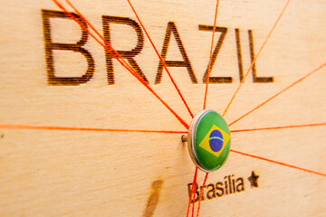 Brazil flag pins and red thread for traveling and planning trips. Planning of logistics routes or...