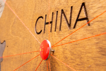 China flag pins and red thread for traveling and planning trips. Planning of logistics routes or...