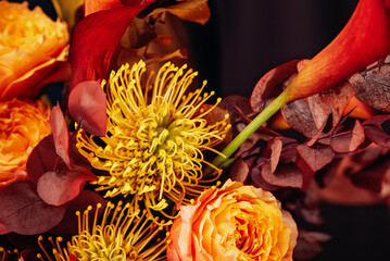 Red pink orange Autumn Colorful fall bouquet. Beautiful flower composition with autumn orange and red flowers. Flower shop and florist design concept. close up, floral background