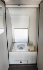 Interior of a modern business turboprop aircraft. Toilet in a small business jet.