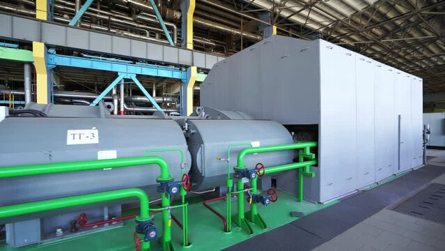 Inside a huge thermal power station, view of pipes and turbines, energy conversion system, environmental issues, power generation system, chp.