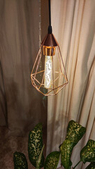 Metal geometric lamp chandelier lamp in loft style and beige curtains