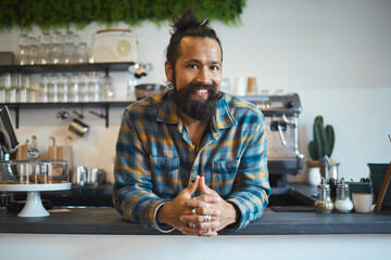 Indian man, portrait and business owner at coffee shop ready for work with a smile. Happy, cafe and...