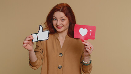 Like. Redhead woman raises inscription thumbs up banner thumbs up agrees with something, gives...