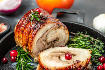 Roast pork meat roll with spices and cranberry. Food recipe background. Close up
