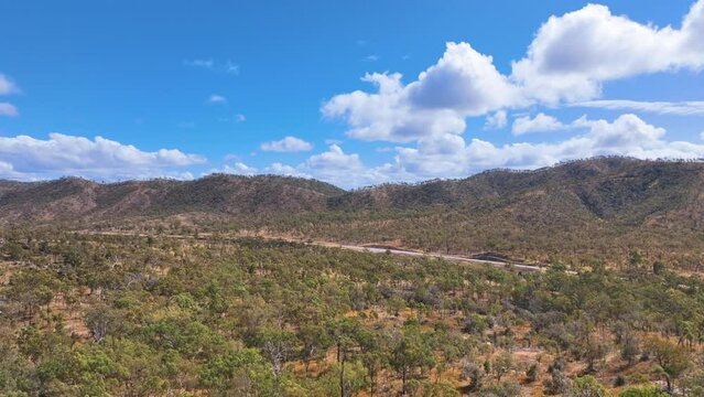 Aerial over arid outback forests to Peter Delemothe Rd Biri Country