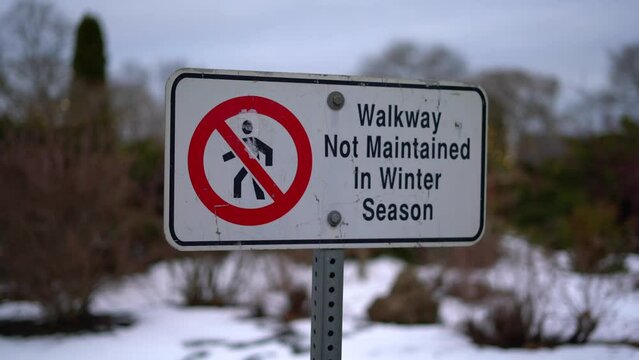 Walking Path Walkway Not Maintained in Winter Season Sign Close Up Pan, Isolated