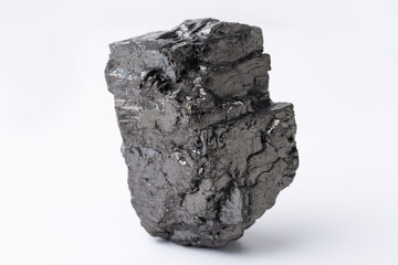 Natural black fossil coal on a white isolated background.