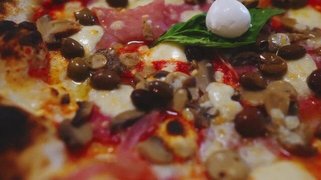 Pizza capricciosa. Pizza with ham, olives, mushrooms and artichokes.