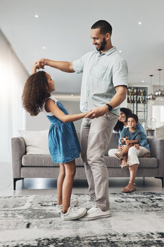 Love, Family And Father Dancing With Girl, Lounge And Happiness Together With Loving, Mother And Son On Couch. Happy, Father Or Daughter Dance In Living Room, Quality Time Or Bonding For Child Growth