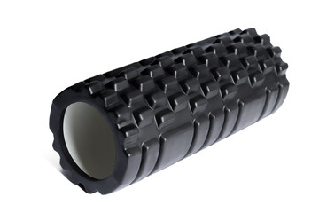 A black foam massage roller isolated on a white background. Foam rolling is a self myofascial...