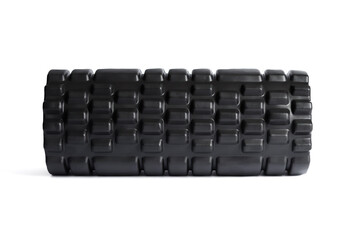 A black foam massage roller isolated on a white background. Foam rolling is a self myofascial...