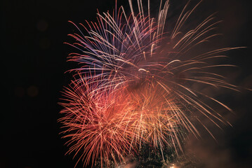 Beautiful fireworks exploded in the sky in  china at night. Chinese New Year and Lantern Festival Festival celebration.