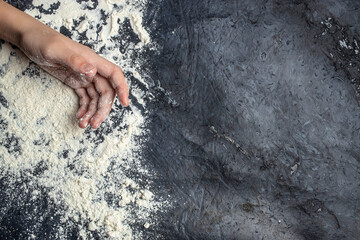 White flour smeared Girl hands with flour. Clean eating, dieting, vegan food concept. top view