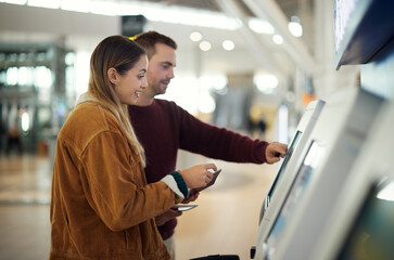 Travel, airport and couple at check in machine with passport and ticket for flight. Valentines day,...