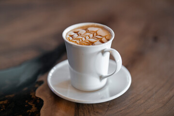delicious latte coffee on wooden table