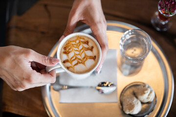 woman drinking delicious latte coffee
