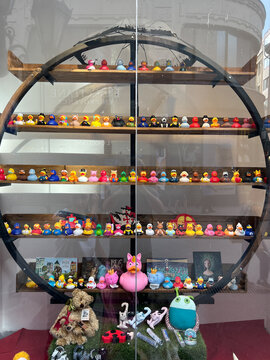 Budapest, Hungary - 13.07.2022: Showcase with toy ducklings in the store. Close-up