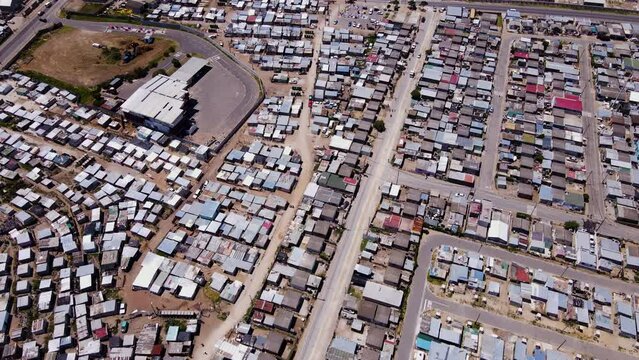 Aerial over township with lots of makeshift houses - urban sprawl in Hermanus