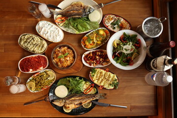 a table with a variety of Turkish appetizer food plates on it