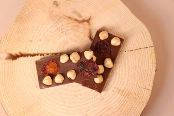 dark chocolate with peanut on wood 
