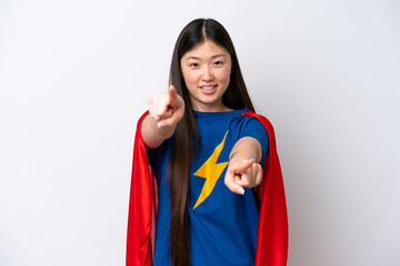 Super Hero Chinese woman isolated on white background points finger at you while smiling