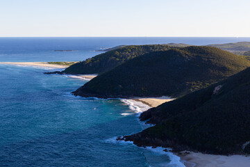 Coastline view of mountain and beach.