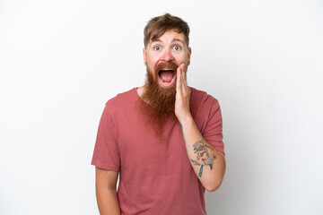 Redhead man with long beard isolated on white background with surprise and shocked facial expression