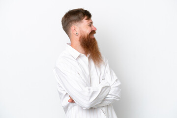 Redhead man with long beard isolated on white background looking side