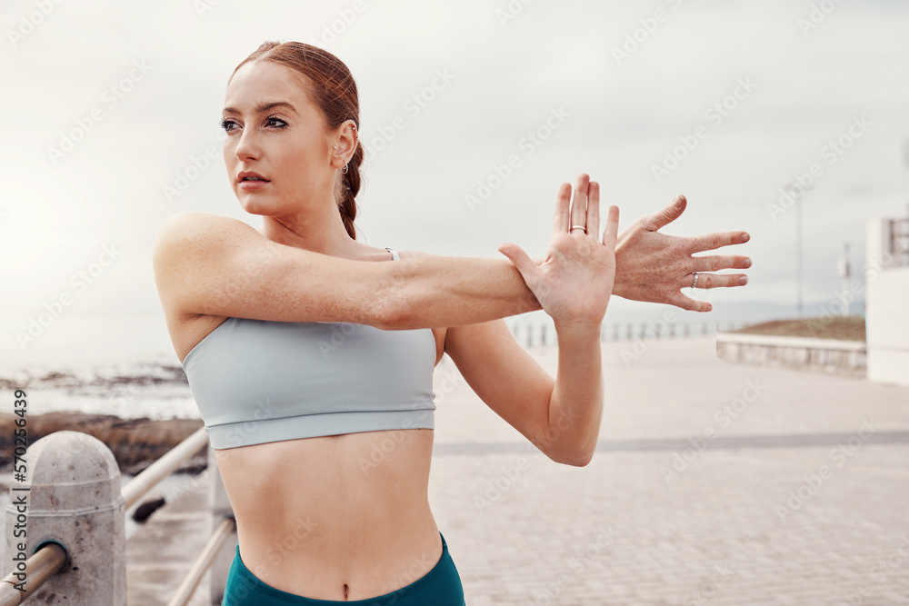 Sticker Fitness, sports and woman stretching arms in city for motivation, warm up and start cardio workout by sea. Running, exercise and girl focus for healthy body, wellness and marathon training by ocean