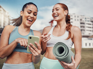 Yoga, fitness and phone with woman friends laughing at a meme in the park together during exercise....