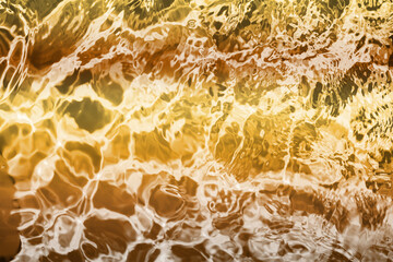 Blurred transparent Yellow Gold colour clear calm water surface texture with splashes and bubbles. Trendy abstract nature background. Water waves in sunlight. water background, oil