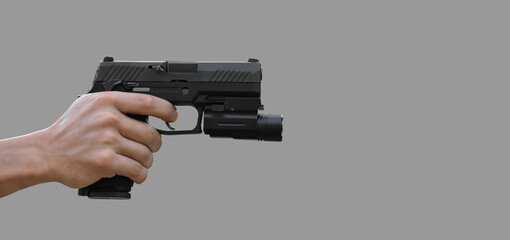 Isolated 9mm pistol gun holding in right hand of gun shooter with clipping paths.