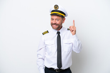 Airplane middle age pilot isolated on white background showing and lifting a finger in sign of the best