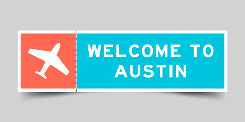 Orange and blue color ticket with plane icon and word welcome to austin on gray background