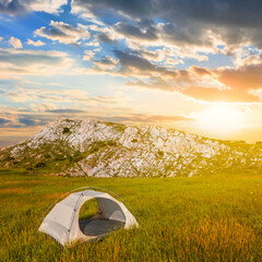 touristic tent stay in mountain plateau at the sunset, mountain touristic camp scene