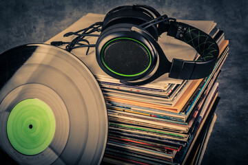 Vinyl records and headphones in retro style