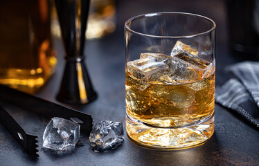 Glass of whiskey with ice