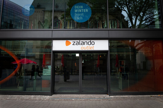 COLOGNE, GERMANY - NOVEMBER 12, 2022: Selective blur on a Zalando logo on their outlet store of Cologne. Zalando is an online german fashion retailer..