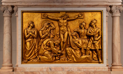 A close-up of a bronze bas-relief representing Jesus crucified, in the Basilica of Fatima - Portugal