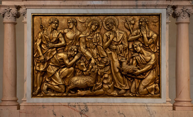 A close-up of a bronze bas-relief representing the birth of Jesus, in the Basilica of Fatima -...