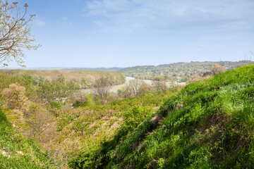 Panorama of the Danube river in Serbia, in Grocka, seen from forests and green fields, with the island of Grocanska ada in the background.