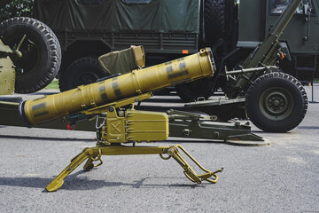 Anti-tank missile system. Against the background of military equipment.