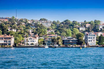 Luxury houses on the Bosphorus strait in Istanbul, Turkey, some in wood, in a residential district...