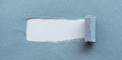 Torn piece of blue paper for hidden text used as template or mockup