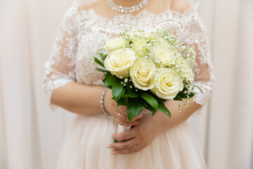 Bride's bouquet in the hands of the bride
